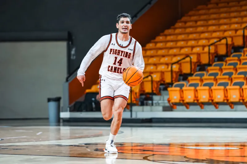Memo Bener bringing the ball up the floor for Campbell